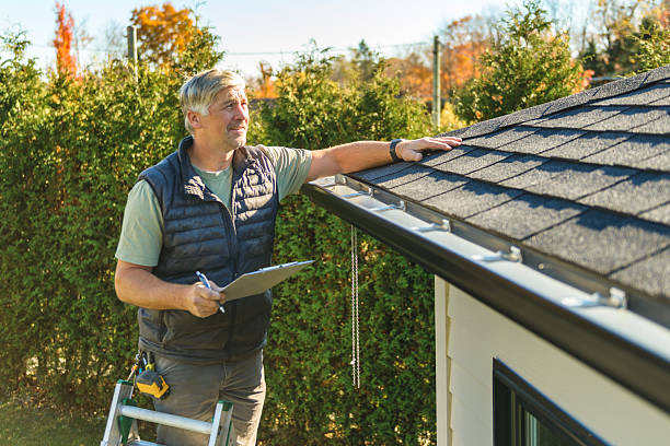 Professional Storm Damage Roof Repair technician working in Manitou, KY